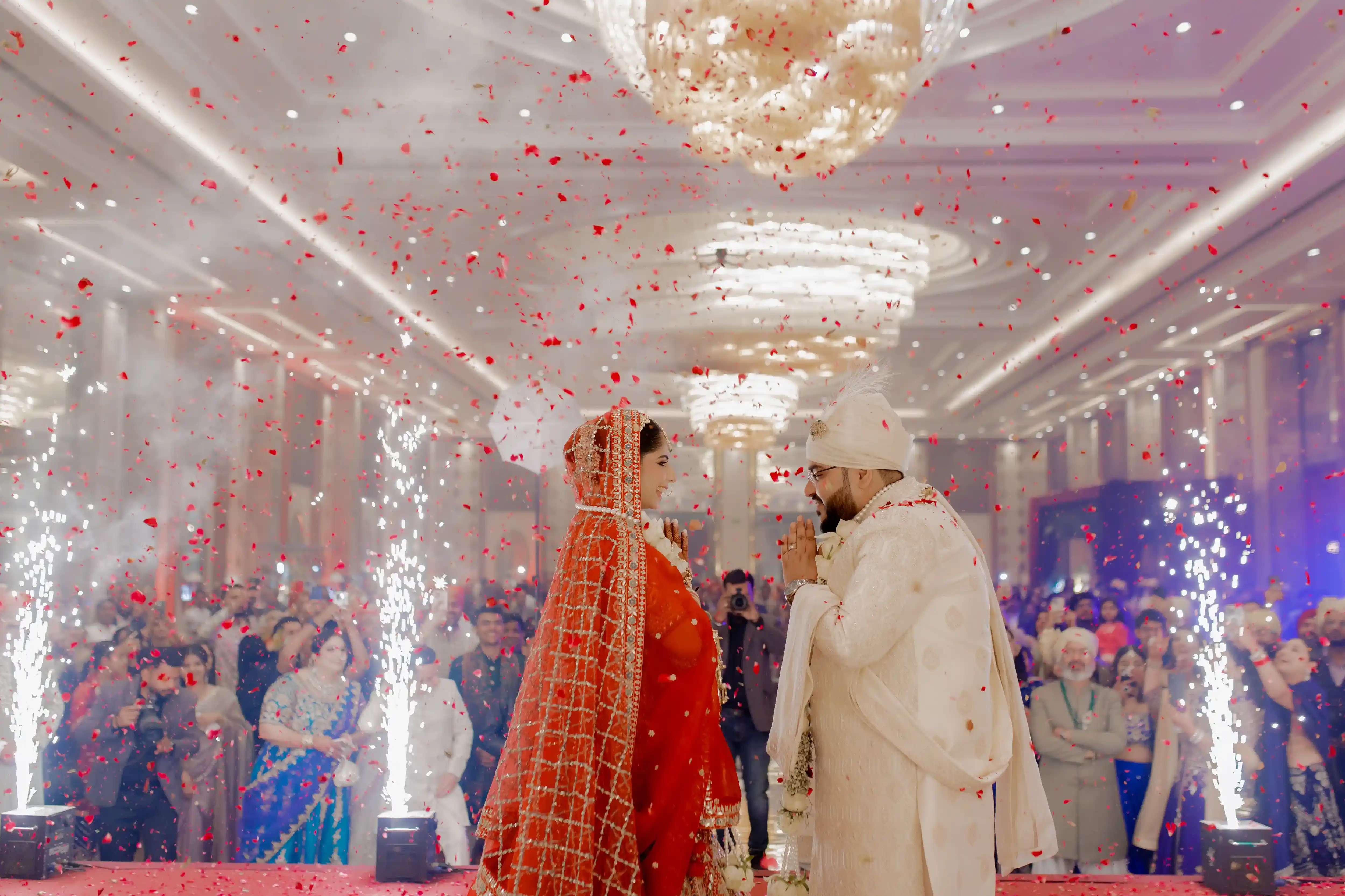 A candid moment of joy between Rishabh and Chahat during their wedding celebration at Oodles, Chattarpur.