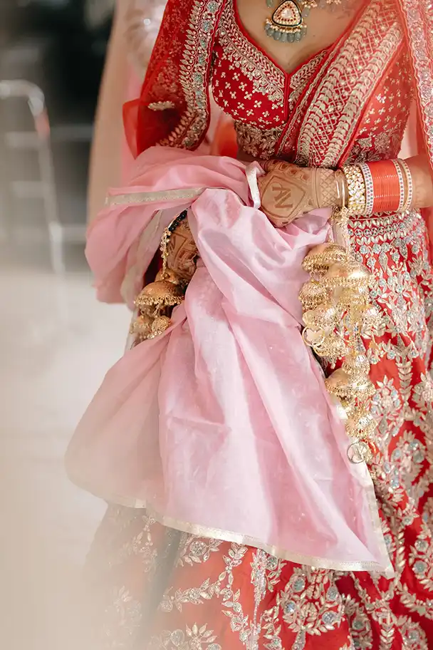 Bride and groom walking together at their destination wedding in Goa.